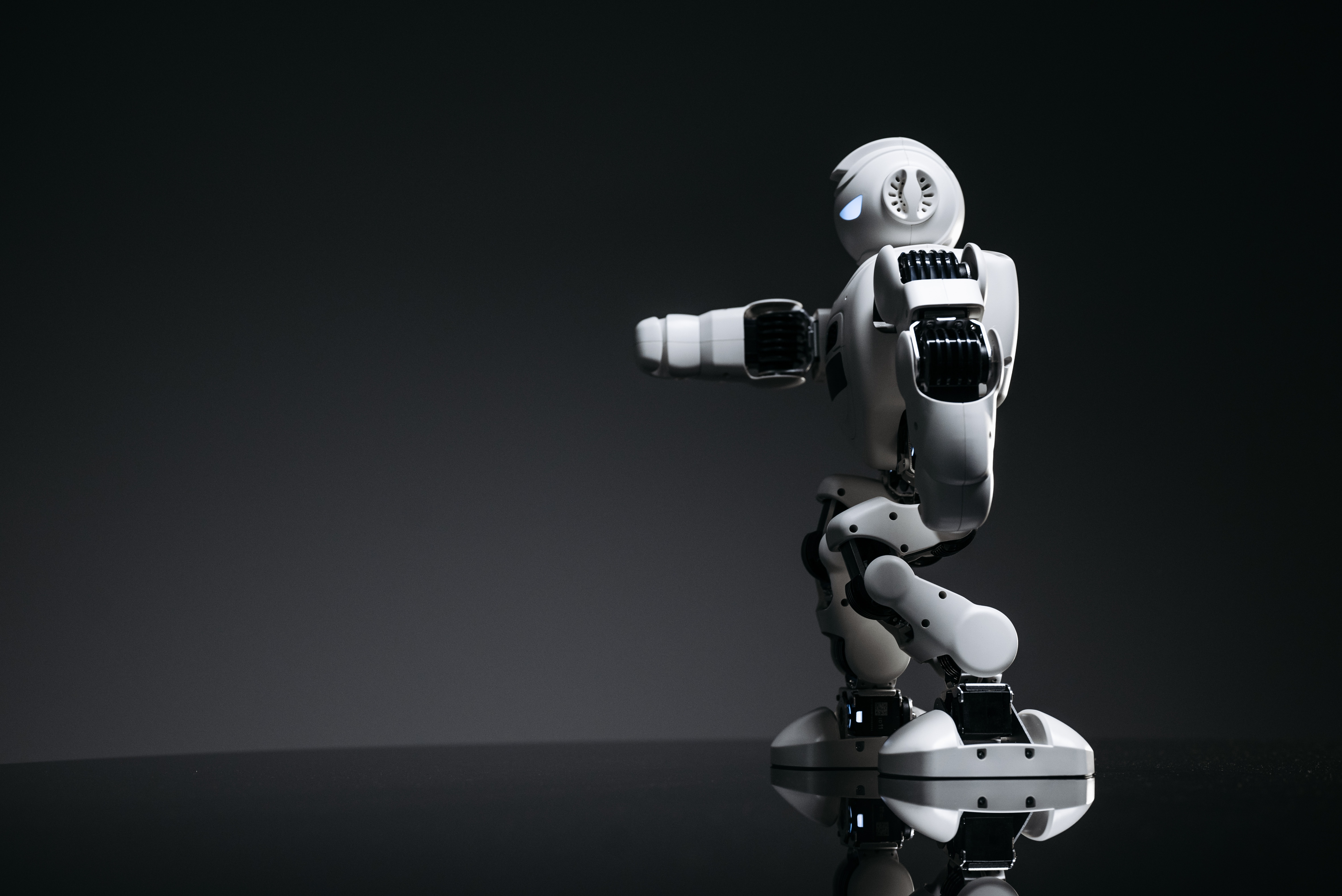 Humanoid robot on a dark studio background
